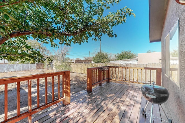 wooden terrace featuring area for grilling