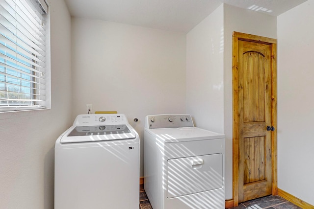 laundry room featuring separate washer and dryer