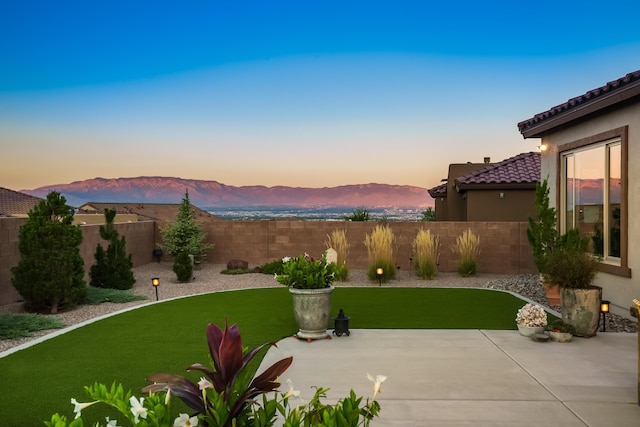 exterior space with a mountain view and a yard