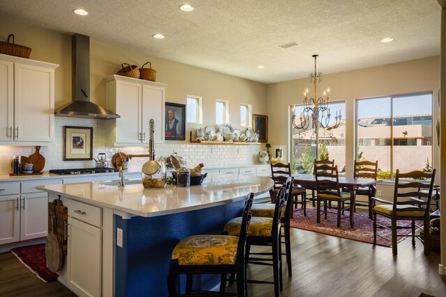 dining area featuring dark hardwood / wood-style floors and an inviting chandelier