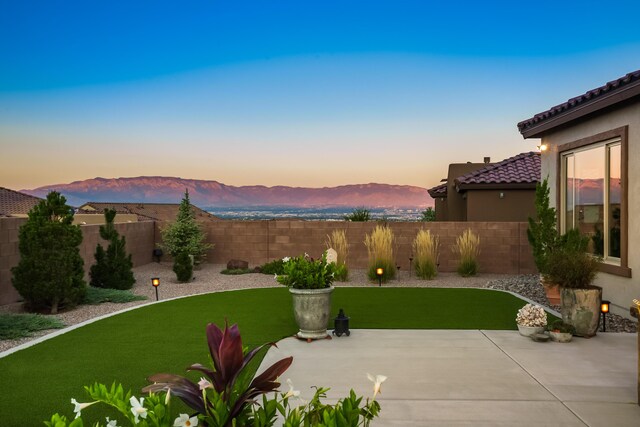 view of swimming pool featuring a mountain view and a patio area