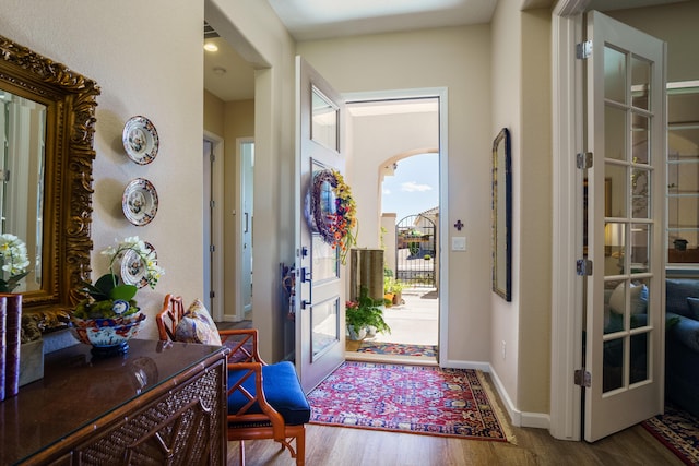 entryway featuring hardwood / wood-style flooring and french doors