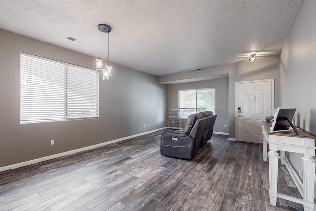 office space featuring a textured ceiling and dark hardwood / wood-style flooring