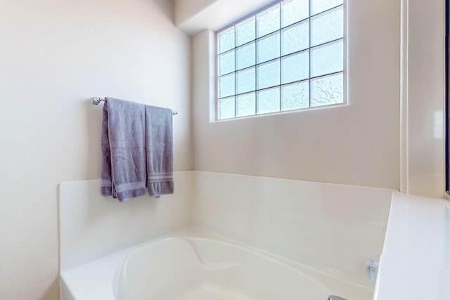 bathroom with a tub