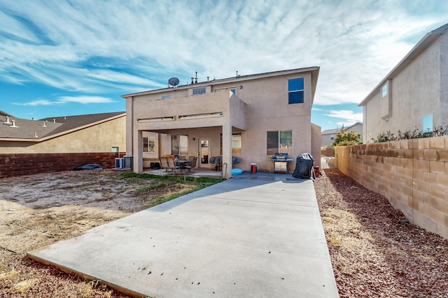 back of house featuring central AC and a patio