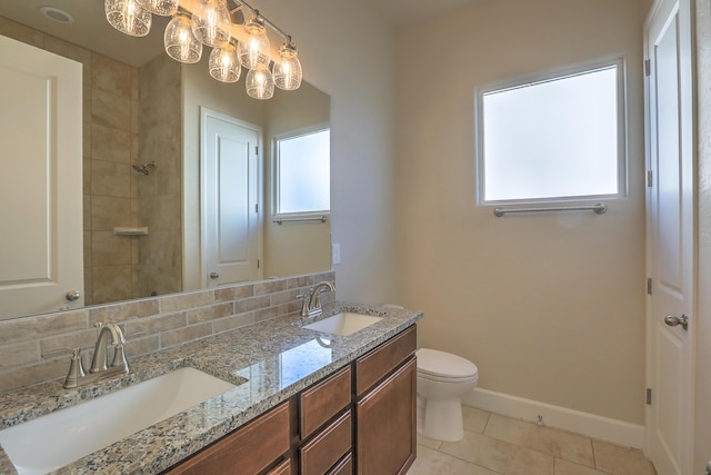 bathroom with decorative backsplash, vanity, tile patterned flooring, and toilet