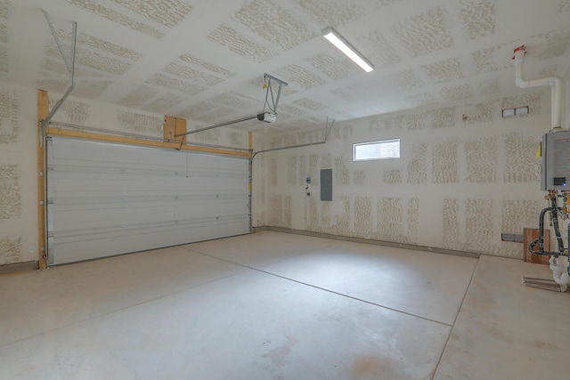 garage featuring a garage door opener and electric panel