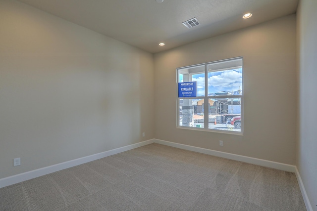 spare room with carpet floors