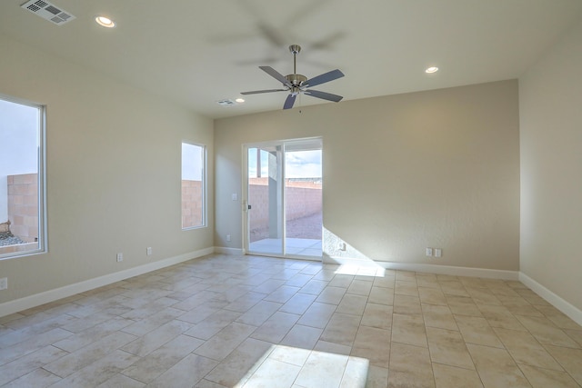 unfurnished room with light tile patterned floors and ceiling fan