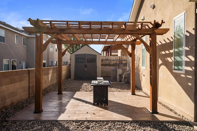 view of patio with an outbuilding, a pergola, a fenced backyard, a storage shed, and central AC unit