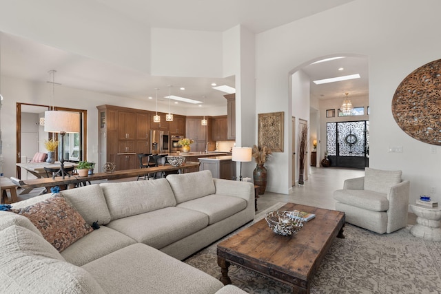 living room with a towering ceiling