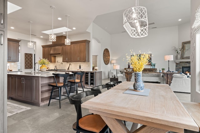 dining space with a stone fireplace