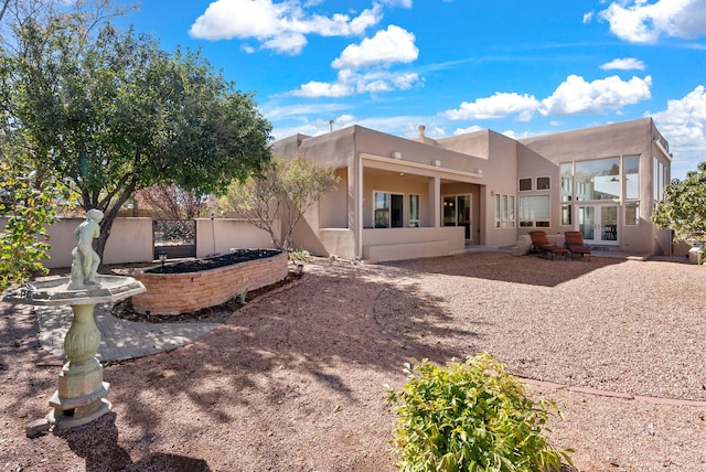 back of property featuring french doors