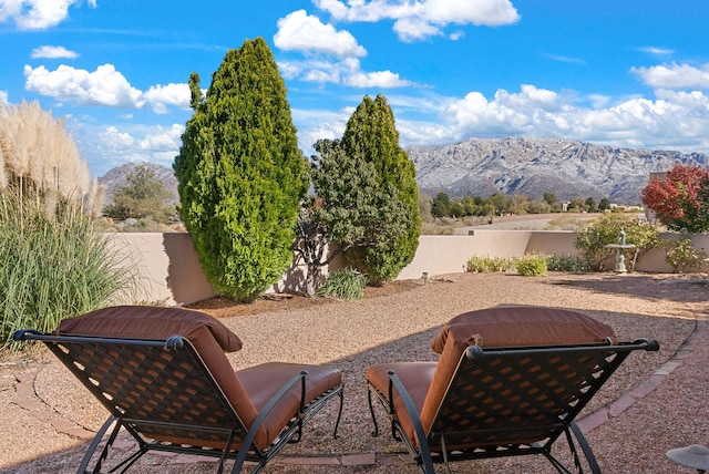 view of patio / terrace featuring a mountain view