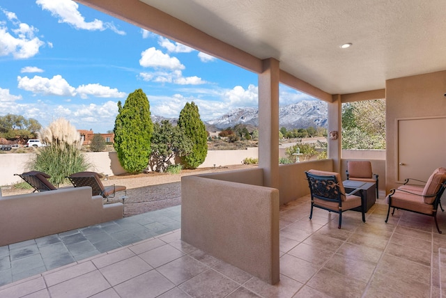 view of patio / terrace featuring a mountain view