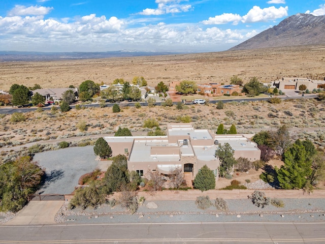 birds eye view of property with a mountain view