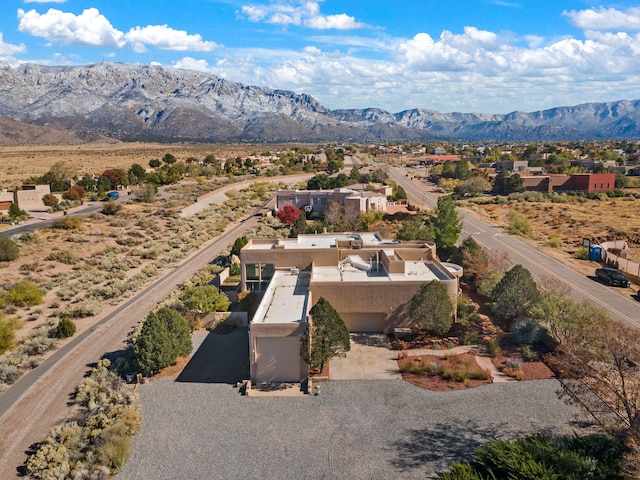 drone / aerial view featuring a mountain view