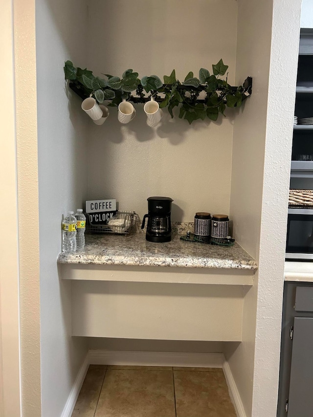 room details featuring oven and tile patterned floors