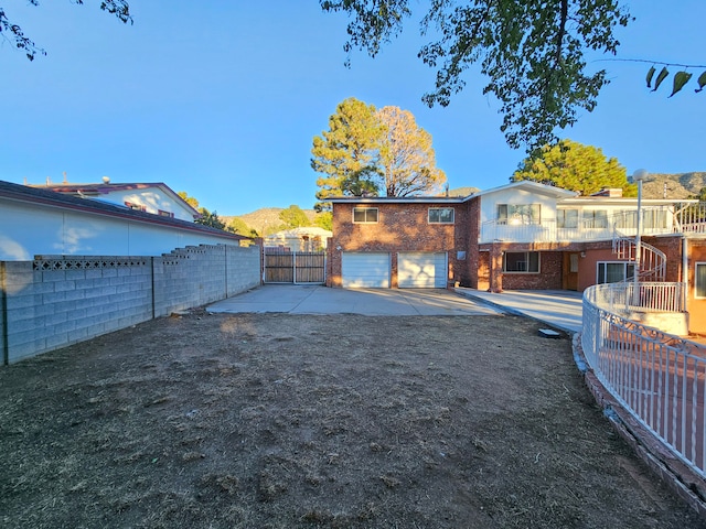 back of house featuring a mountain view