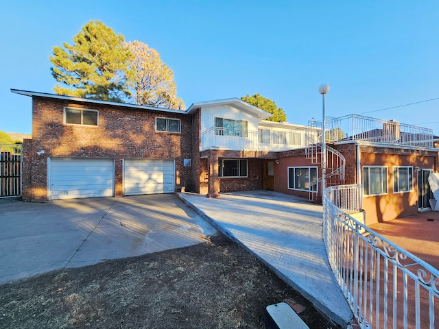 view of front of house with a balcony and a garage