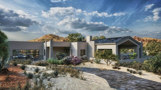 53 Evergreen Dr, Placitas, NM 87043 - rear view of property with stucco siding, a mountain view, and stone siding