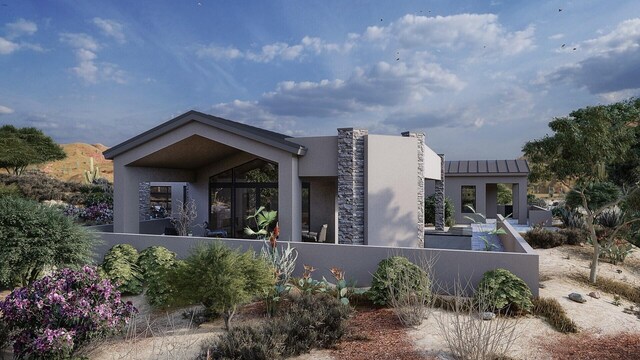 53 Evergreen Dr, Placitas, NM 87043 - view of front of home featuring a standing seam roof, stucco siding, and a metal roof