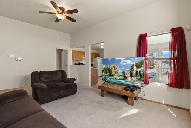 living room with light colored carpet and ceiling fan