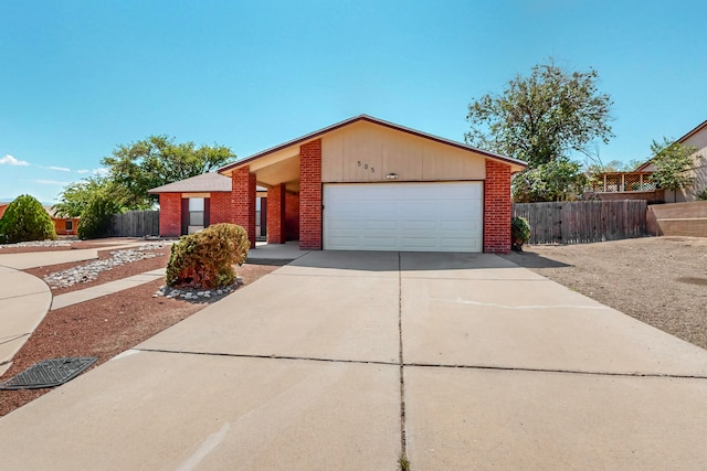 ranch-style home featuring a garage