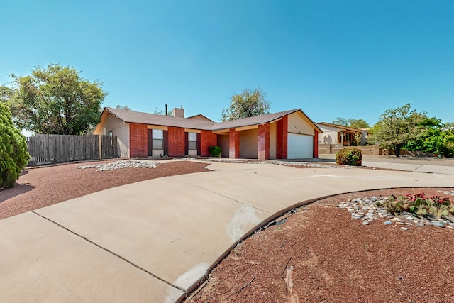 ranch-style house featuring a garage