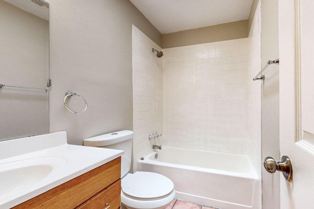 full bathroom featuring tile patterned flooring, vanity, toilet, and tiled shower / bath