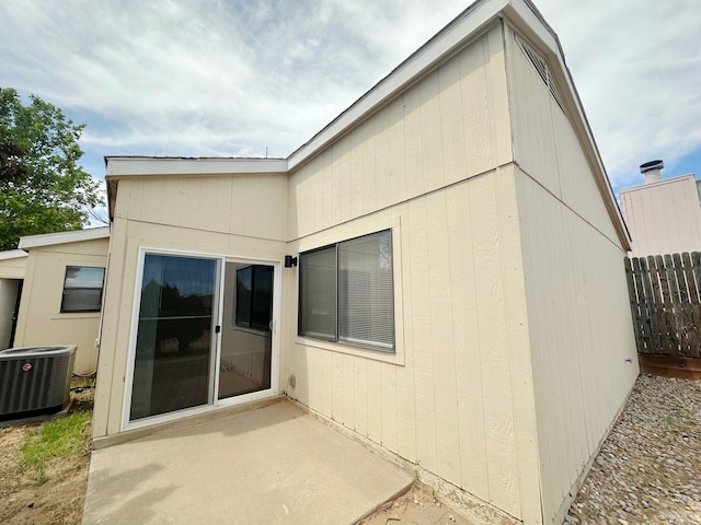 back of house featuring central AC unit