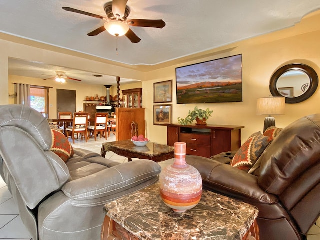 living room with tile patterned floors and ceiling fan