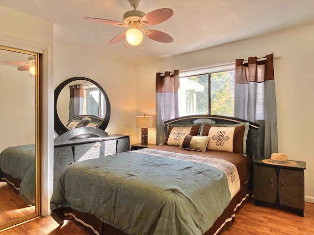 bedroom featuring ceiling fan and light hardwood / wood-style floors