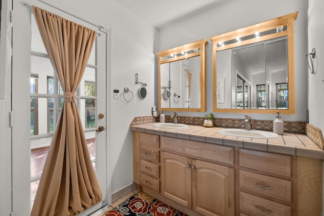 bathroom with tile patterned flooring and vanity