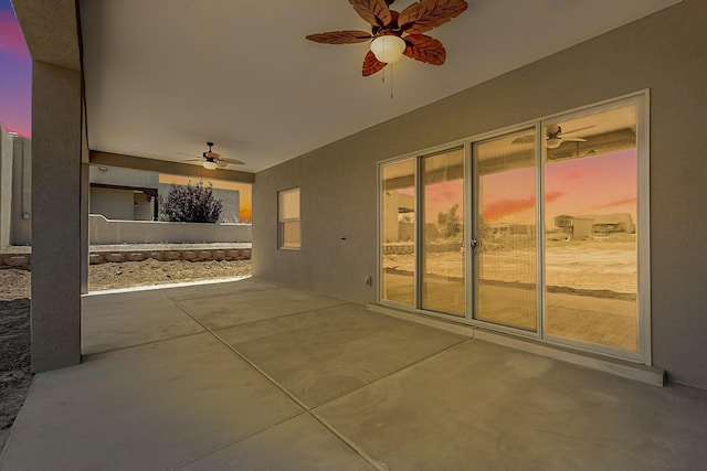 view of patio terrace at dusk