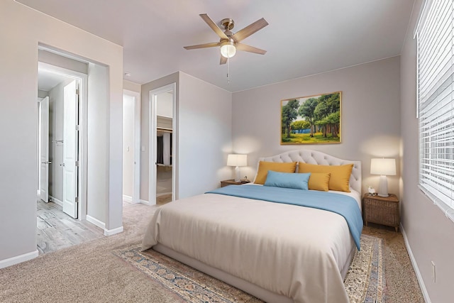 bedroom featuring ceiling fan and light colored carpet