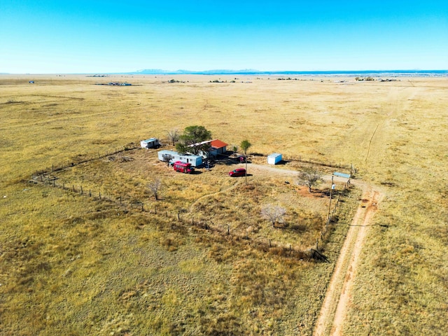 birds eye view of property with a water view and a rural view