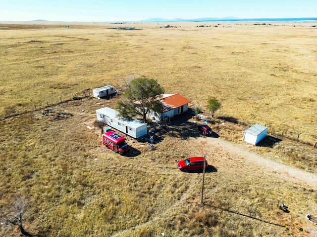 birds eye view of property with a rural view