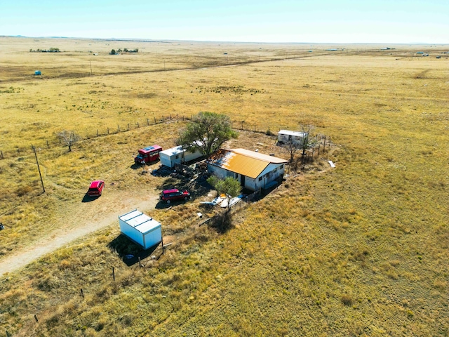 birds eye view of property featuring a rural view