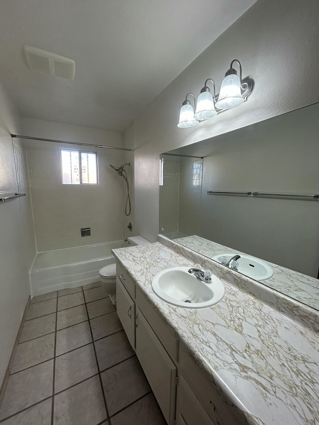 full bathroom with toilet, vanity, tile patterned floors, and tiled shower / bath