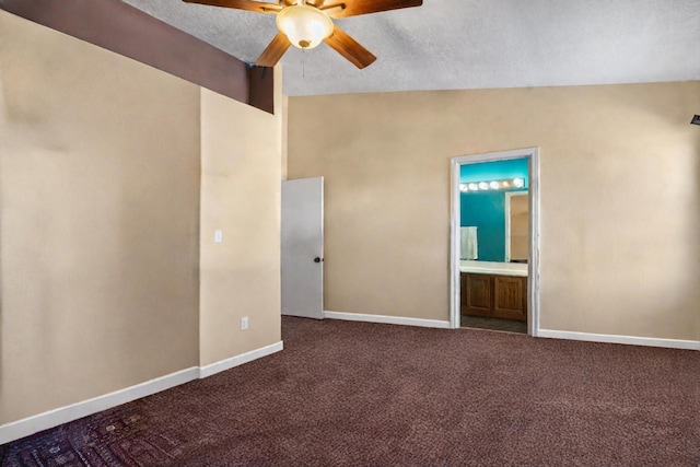 empty room with vaulted ceiling, ceiling fan, a textured ceiling, and carpet floors