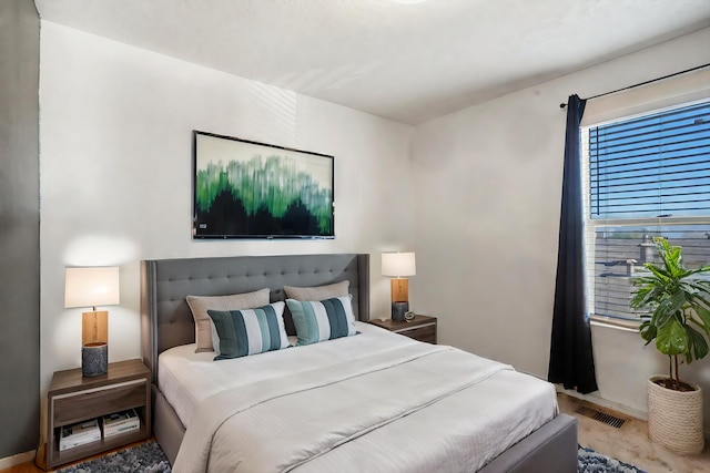 bedroom featuring wood-type flooring