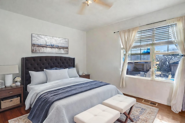 bedroom with hardwood / wood-style floors and ceiling fan