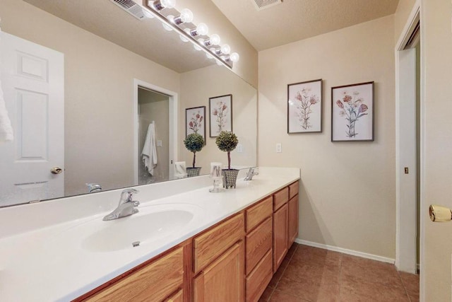 bathroom featuring vanity and tile patterned floors