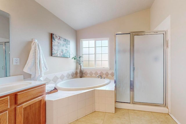 bathroom featuring tile patterned flooring, vanity, lofted ceiling, and independent shower and bath