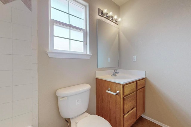 bathroom with vanity and toilet