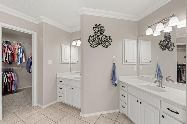 bathroom with vanity, tile patterned flooring, and crown molding