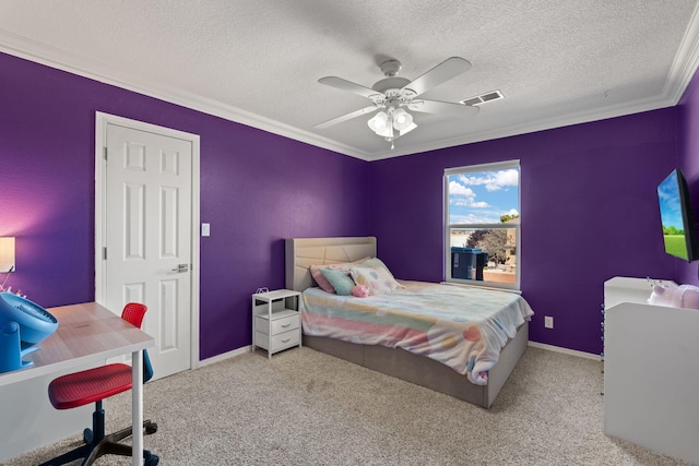 carpeted bedroom featuring crown molding, ceiling fan, and a textured ceiling