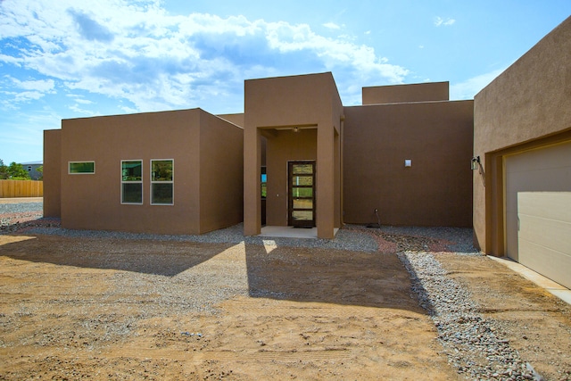 southwest-style home with a garage