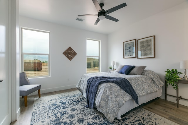 bedroom featuring hardwood / wood-style flooring and ceiling fan